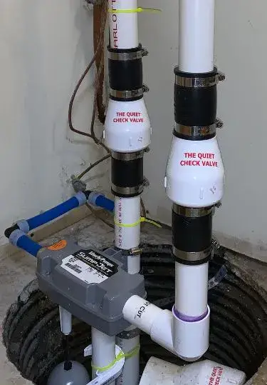 Sump basin with a quiet check valve